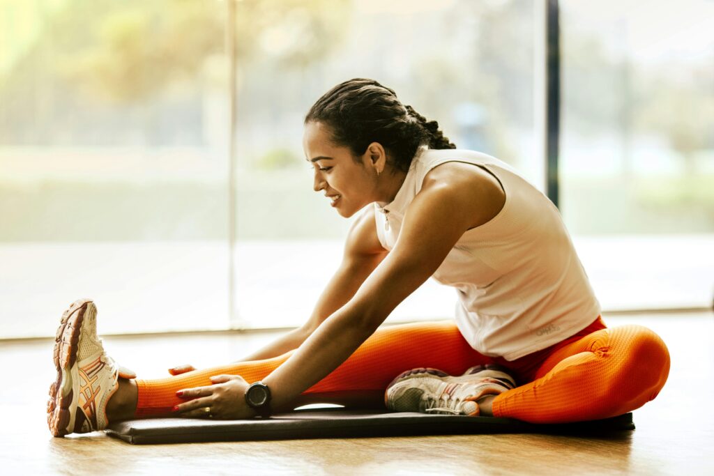Woman stretching on a yoga mat
